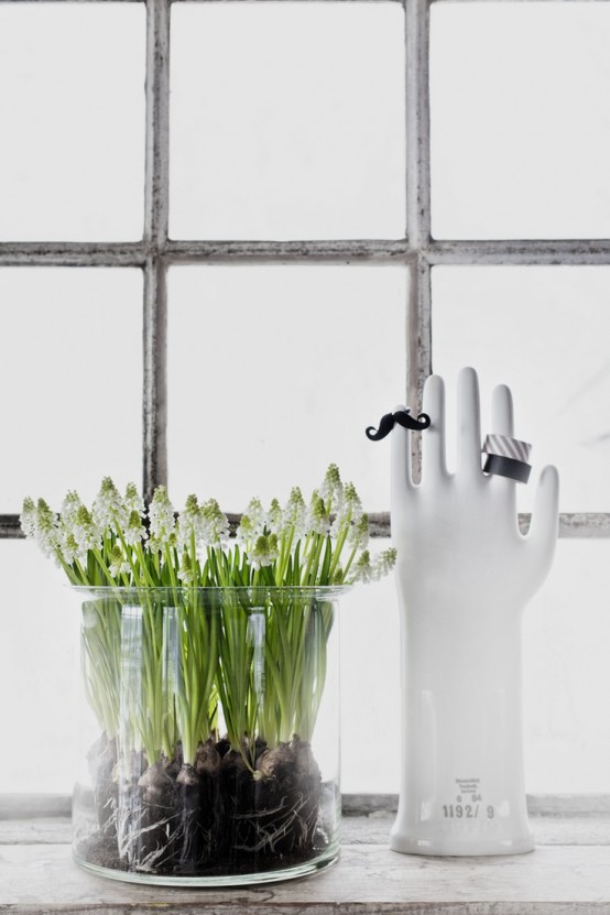 a sheer glass vase with multiple white hyacinths is a lovely decor idea that you may rock anytime