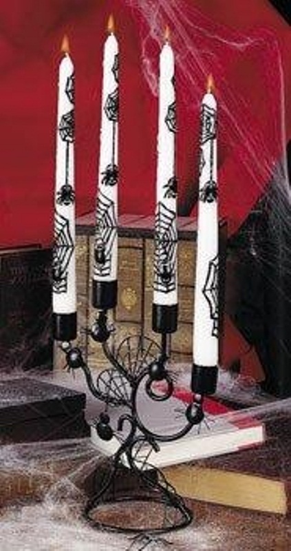 You can freehand-paint some creepy spiders even on simple white candles.