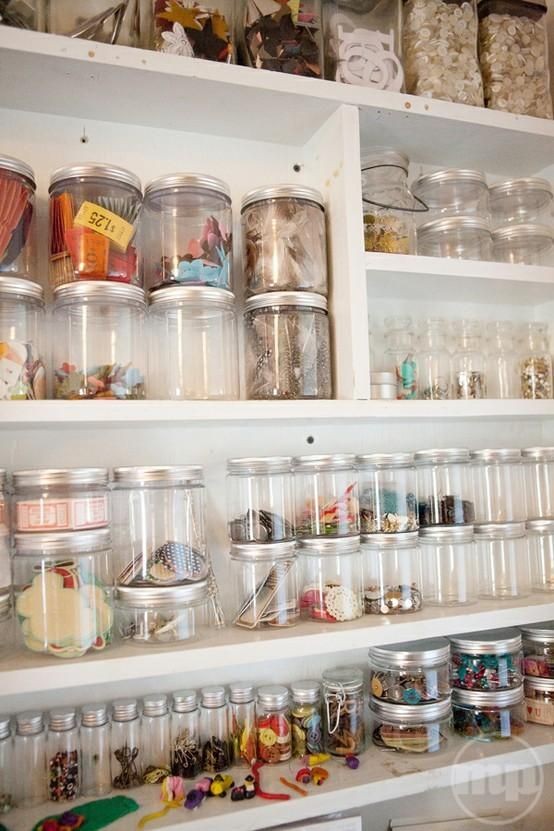 an oversized shelving unit with ltos of jars that will allow organizing small stuff