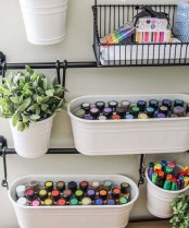 holders with hanging wire baskets and containers for storage plus a planter