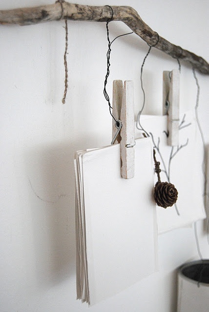 a holder with various notes and photos hanging