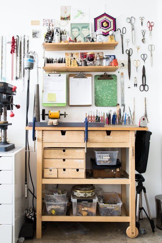 a cratign station made of an IKEA Forhoja cart, with some shelves over it and a pegboard with hooks for storing even more things