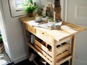 an IKEA forhoja cart used as a gardening station allows storign a lot of things and use the countertop for planting