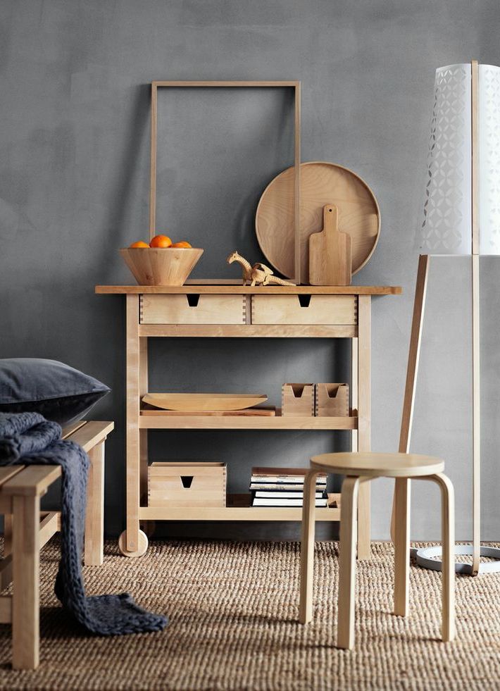 an Ikea Forhoja cart used as a usual console table   it's great for any space due to have many open and closed storage compartments