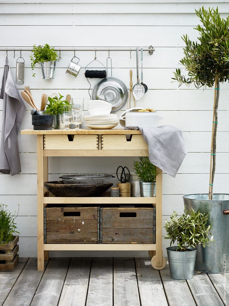 an Ikea Forhoja cart used for outdoors   for storing tableware, pots, planters, drinks and other stuff as a normal cart
