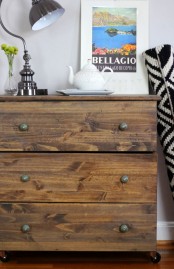 a dark stained Tarva dresser with vintage metal knobs perfectly fits a rustic space