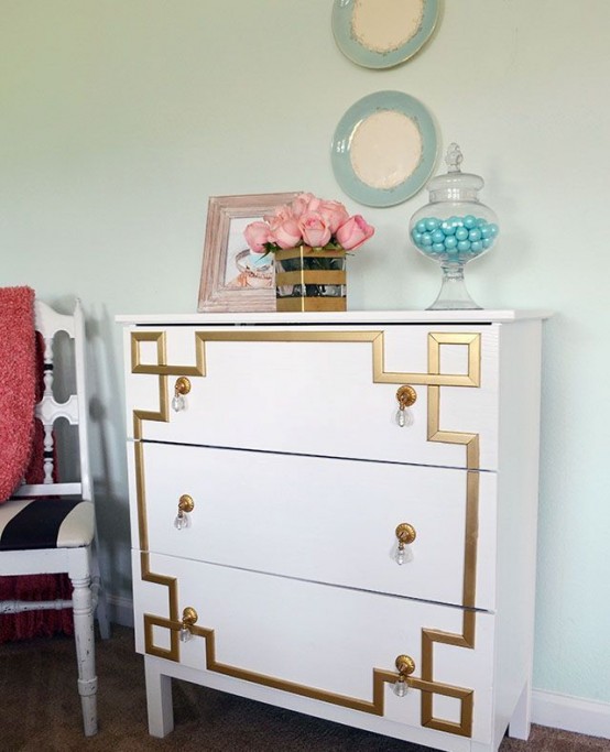 a vintage-inspired Tarva dresser with gold inlays and gold and crystal pulls for a touch of art deco