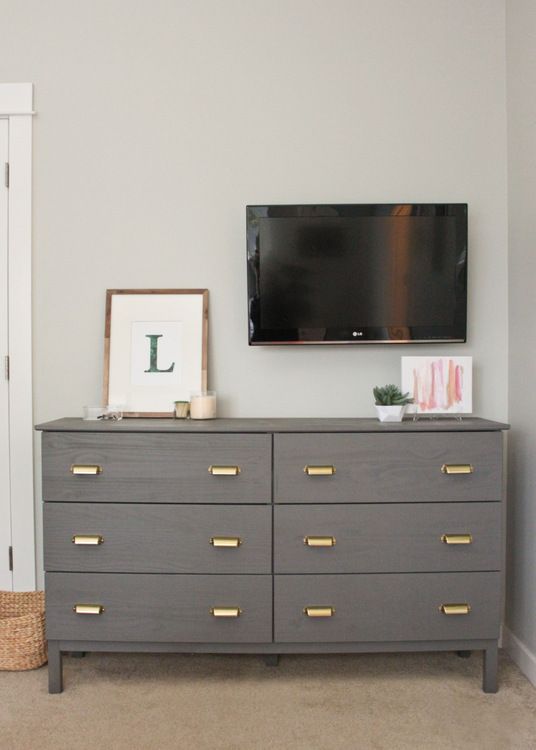 a grey Tarva hack with brass retro-inspired pulls is a classic and chic storage item