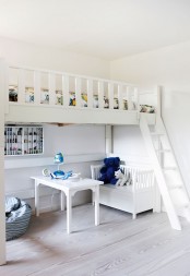 a white kid’s space with a sitting zone downstairs and a loft bedroom with just a single bed is a lovely idea for a small space