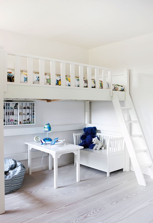 a white kid's space with a sitting zone downstairs and a loft bedroom with just a single bed is a lovely idea for a small space