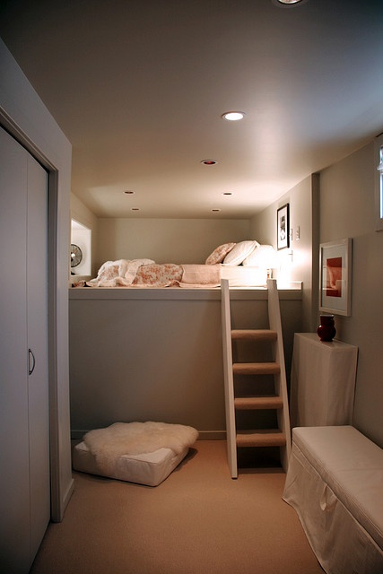 a small loft bedroom with only a low bed and some lights allows to get a separate sleeping zone even in the tiniest dwelling