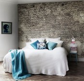 a contemporary bedroom with a faux brick wall done with wallpaper, it’s an easy way to add interest to the space