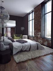 a contemporary bedroom is spruced up with a fake red brick wall that makes it less polished and more interesting