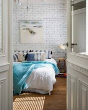 refresh your simple bedroom with a fake white brick wall, which is easy to recreate with panels