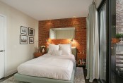 a fake red brick wall adds inteerst and a modern touch to the contemporary space