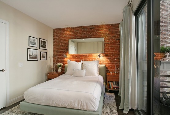 a fake red brick wall adds inteerst and a modern touch to the contemporary space
