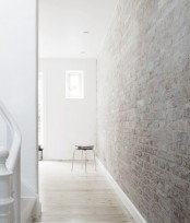 a Nordic and airy space can be finished with a whitewashed brick wall and