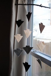 a cool mobile with muted color felt arrows is a stylish idea for any space, it looks cool and fresh and accents the room