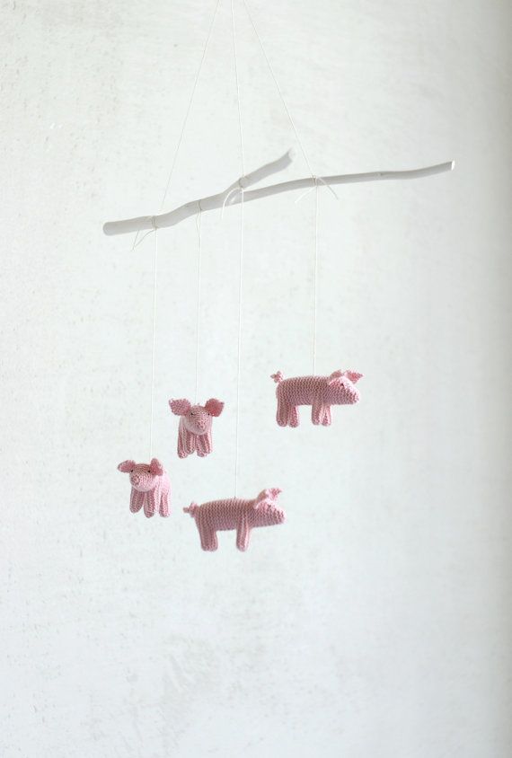 a fun nursery mobile with white branches and pink crochet pigs is a cute idea for a nursery, you can DIY it