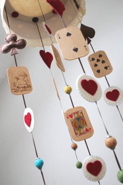 a unique card mobile with cards, hearts and other colors of felt is a super cool and creative idea to rock