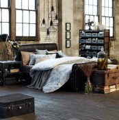 a vintage bedroom with industrial touches, with rough walls and a wooden window frame, a leather bed and pendant industrial lamps, wooden chests for storage