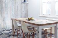 industrial dining area with whitewashed wood walls and cool pattern on a floor