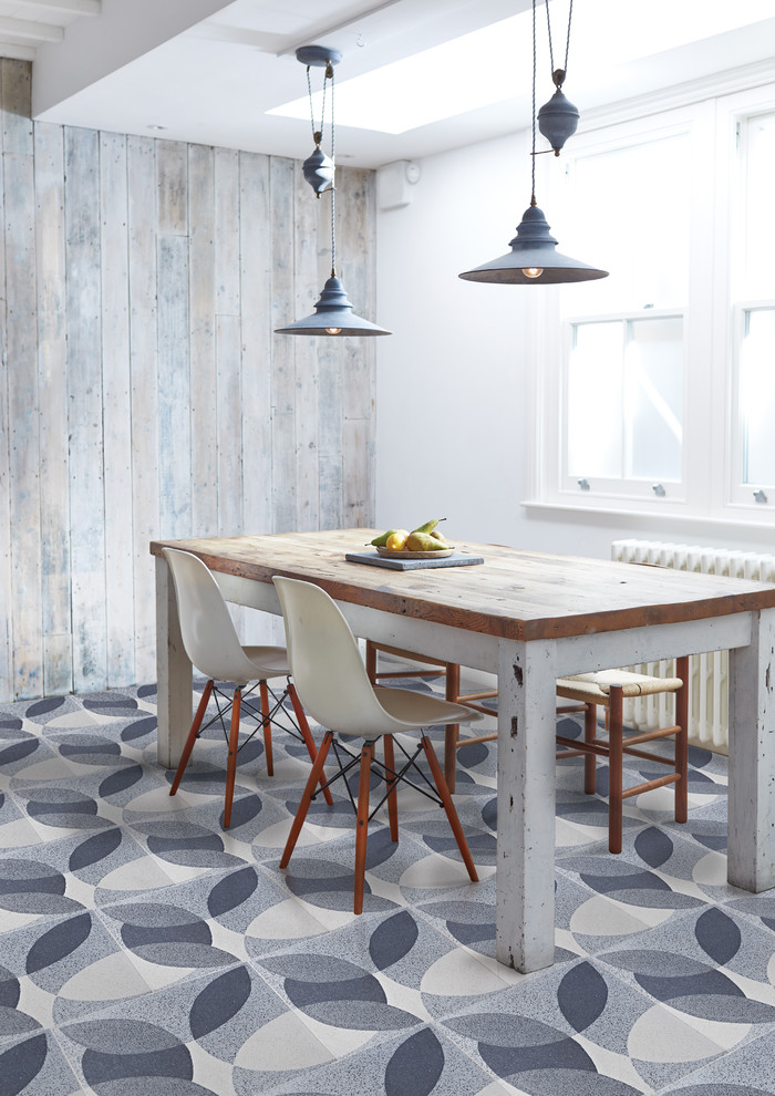 industrial dining area with whitewashed wood walls and cool pattern on a floor