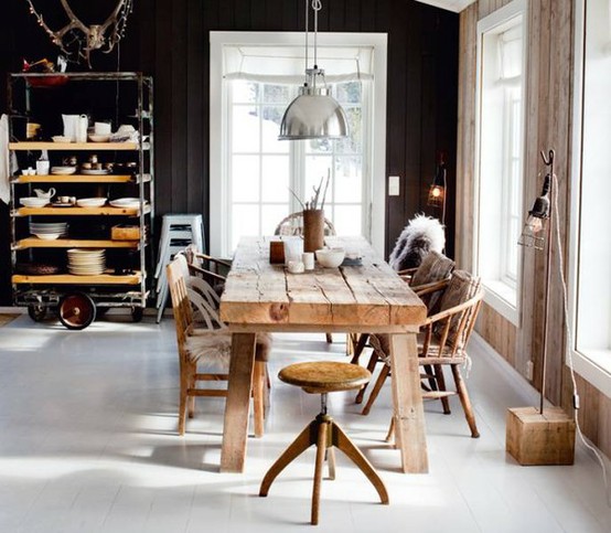 Natural rustic wood, vintage shelving and black walls looks great together on this cozy kitchen.