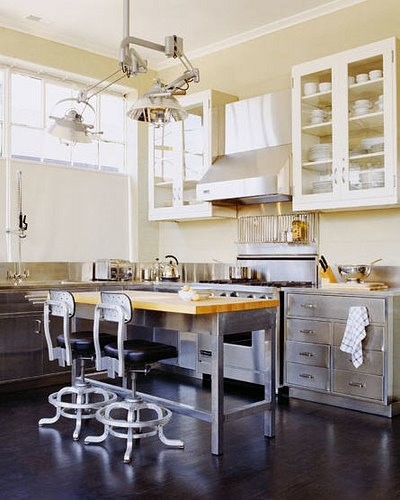 Industrial lamps are those things that are more than welcome in many interiors. Lovely vintage chairs look great on this kitchen too.