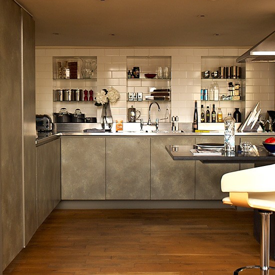 Kitchen cabinets that reminds faux concrete is an interesting alternative to bare concrete walls.