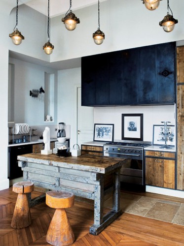 Rustic doors and rustic kitchen island looks great together. Pendant lights are awesome when they come in a large group.