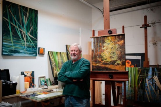 painter Paul Rowntree in his studio with easels, desks, stools and bold artworks