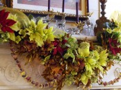 a bold and lush Christmas mantel with super lush faux flower garlands, nut and acorn garlands and glass deer with gilded antlers