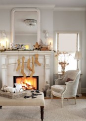 a simple modern Christmas mantel with PEACE letters, wooden stockings, a wooden star and a stack of books