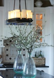 cherry blossom in bottles are a great way to make any space feel more like spring and make it blooming, too