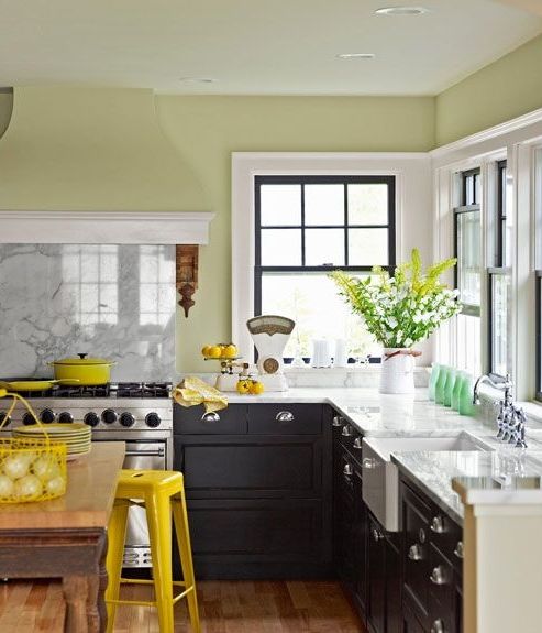 bright yellow items, lemons and cookware make the kitchen feel spring-like and yellow blooms echo with them all