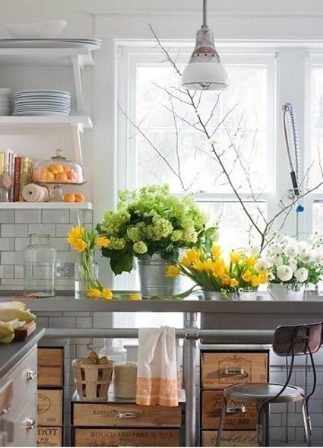 fresh blooms in green, white and yellow and greenery make the kitchen feel more spring-like, bold and fun