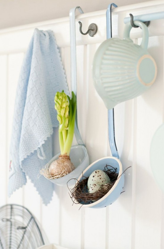 ladles with a faux nest with a blue egg and a spring bulb are cute touches for spring kitchen decor
