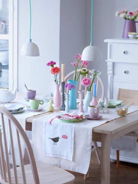pastel tableware, bright blooms and pastel napkins make the kitchen feel more spring-like