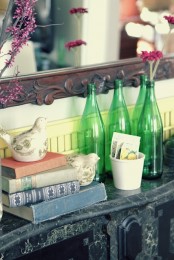 fake birds and some blooms are enough to style a mantel for spring with no fuss