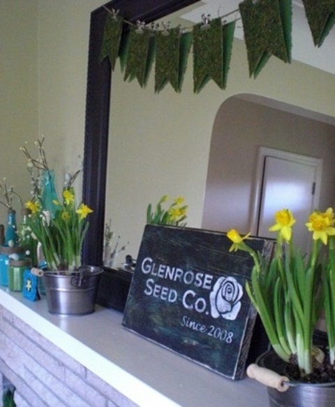daffodils in buckets and a vintage chalkboard sign plus a bunting on the mirror