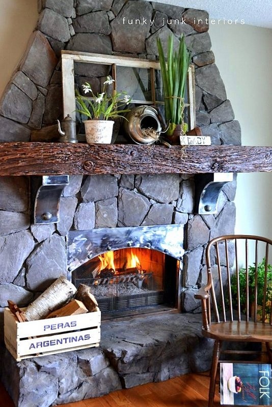 a rustic spring mantel with potted bulbs and vintage teapots