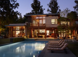 Irregularly Shaped House With A Small Grove Of Eucalyptus And Pine Trees