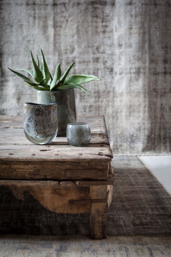 coarse fabric, a rough wooden table and glass vases and pots for creating a chic look