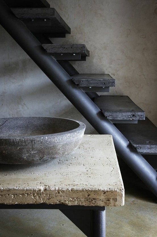 a stone bench plus a stone sink, a metal and stone staircase in black for adding minimal and wabi-sabi aesthetics