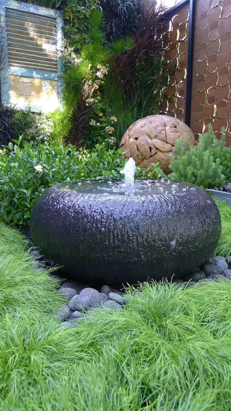 a creative and ultra minimalist black bowl fountain is a lovely idea for a modern, minimalist or zen like garden