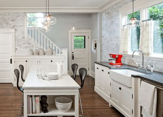 Open shelving in a kitchen island is perfect way to have things on hand. Recipe books or even some salad bowls could fit there.