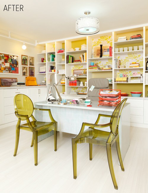 a welcoming home office with plenty of color, shelves with yellow backing, a white desk and green chairs, some colorful art and a memo board
