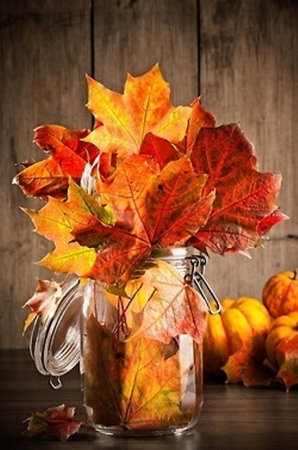 a jar with natural fall leaves is a lovely modern fall centerpiece you can make in a couple of minutes