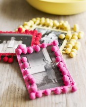 old family photos covered wiht bright red, yellow and pink pompoms to make them cool, bright and more modern